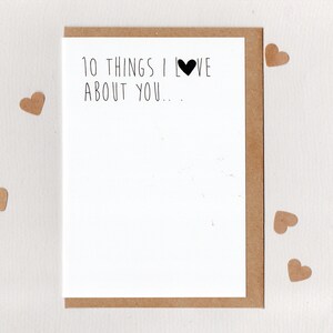 May include: A blank card with a brown envelope. The card has the text "10 things I love about you..." with a black heart.