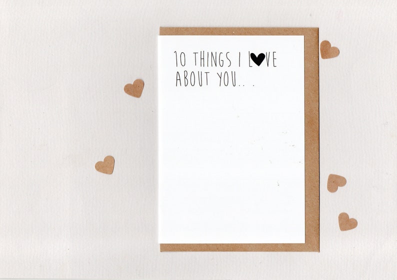 May include: A blank card with a brown envelope. The card has the text "10 things I love about you..." with a black heart symbol.
