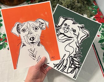 May include: Two black and white line drawings of dogs on separate orange and green backgrounds. The dog on the orange background is looking at the viewer. The dog on the green background is looking to the right. Both drawings have the initials "mc" in the bottom right corner.