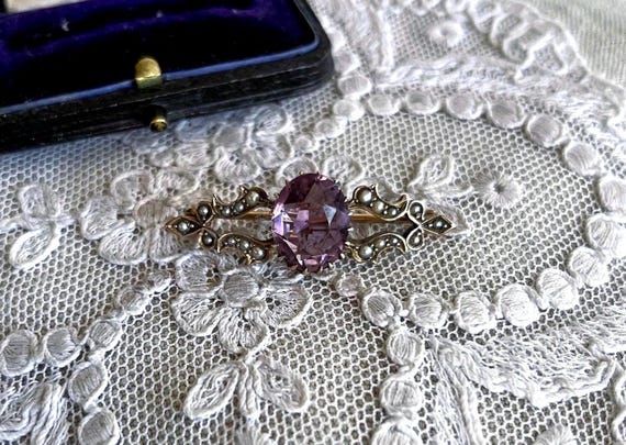 Fine antique Victorian Romantic Era 9k Yellow Gold genuine faceted Amethyst luminous Seed Pearl accented ornate scrolled Lapel Brooch