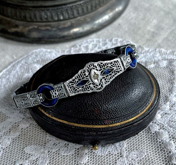 Elegant antique Phillips Edwardian 1910-20s Rhodium Plated Filigree brilliant faceted Sapphire Blue and White Paste Stone Link Bracelet