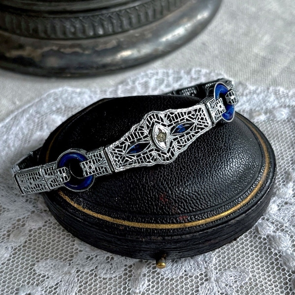 Elegant antique Phillips Edwardian 1910-20s Rhodium Plated Filigree brilliant faceted Sapphire Blue and White Paste Stone Link Bracelet