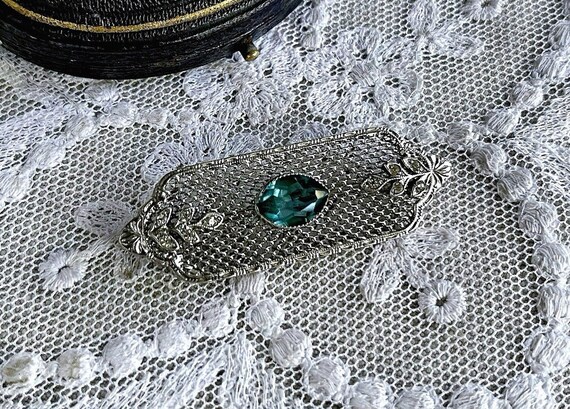Pristine 1930s Art Deco Sterling Silver Rhodium plated filigree brilliant faceted Blue Paste Stone accented sparkling statement Brooch