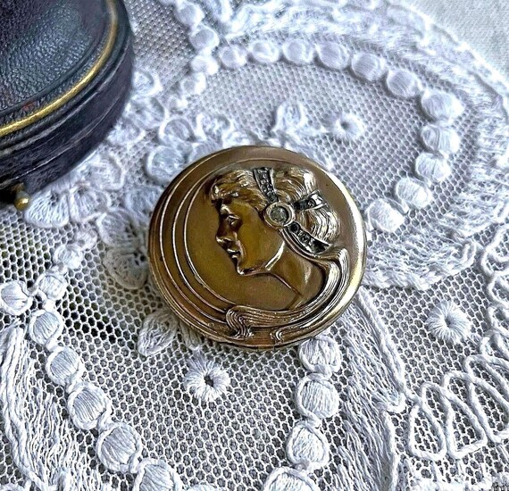 Lovely antique Victorian Gold Filled Pinchbeck brilliant faceted Paste Stone accented Repousse Silhouette figure functional Locket Brooch
