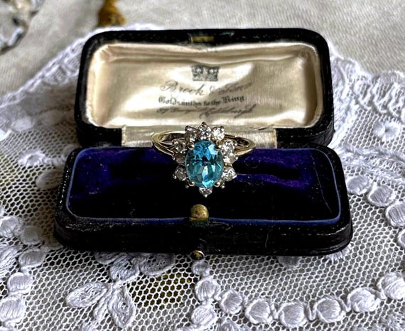 Dazzling vintage solid 10K Yellow Gold brilliant genuine Blue Tooaz gemstone brilliant CZ accented size 7 hallmarked Cocktail Ring