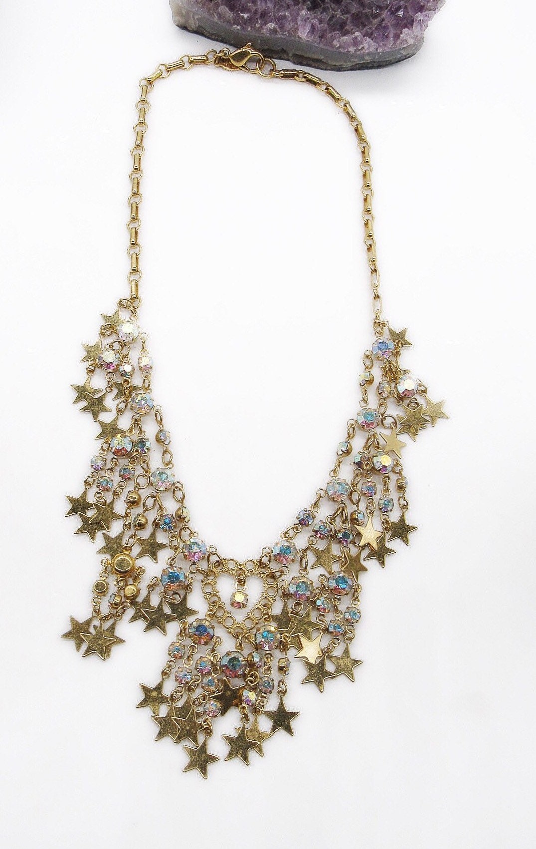 Vintage Kirks Folly cascading brilliant gold tone stars and faceted ...