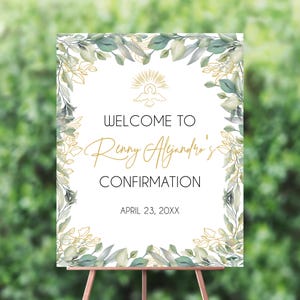 May include: White sign with a gold border and green watercolor leaves. The sign says "Welcome to Renny Alejandro's Confirmation" and "April 23, 20XX".