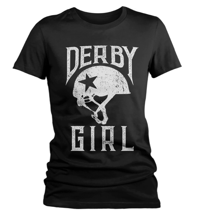 May include: Black t-shirt with a white graphic of a roller derby helmet with a star and the text "Derby Girl".