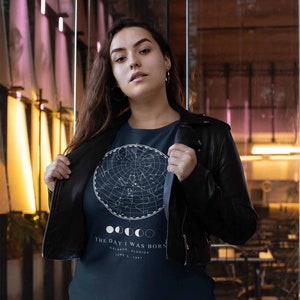 May include: A navy blue t-shirt with a white constellation map and the text "THE DAY I WAS BORN" with the date and location "ORLANDO, FLORIDA JUNE 5, 1997".