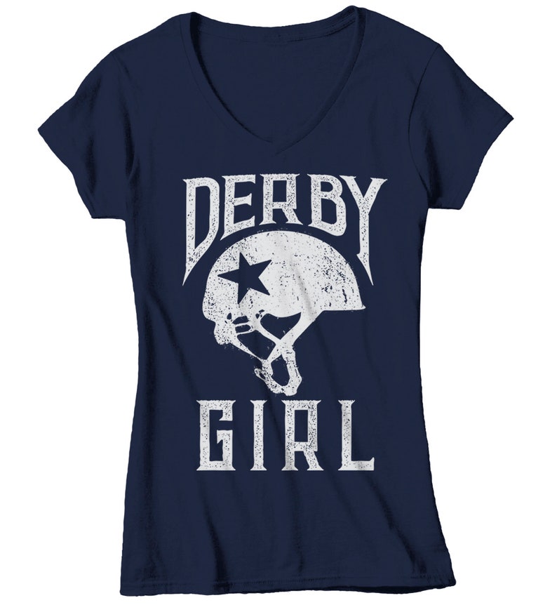 May include: Navy blue v-neck t-shirt with a white graphic of a roller derby helmet and the text "Derby Girl".