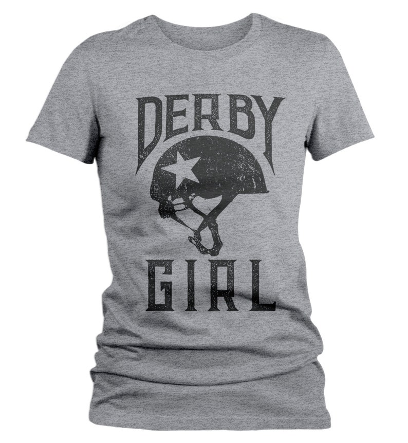 May include: Gray t-shirt with a black graphic of a roller derby helmet with a star and the text "DERBY GIRL".