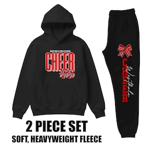 May include: Black two-piece fleece set. The hooded sweatshirt features the text "WESTDALE HIGH SCHOOL CHEER" in red and white, along with pom-pom graphics. The matching sweatpants have a red bow and "Westdale Cheer" in a vertical design.