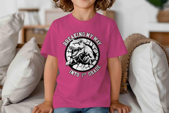Kids 1st Grade Shirt Dinosaur TShirt T-Rex Breaking Into T-Shirt TRex Dino First Grader Gift T Shirt Cute Girl's Boy's Children's Youth