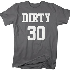 May include: A dark gray t-shirt with the text "DIRTY 30" in white.