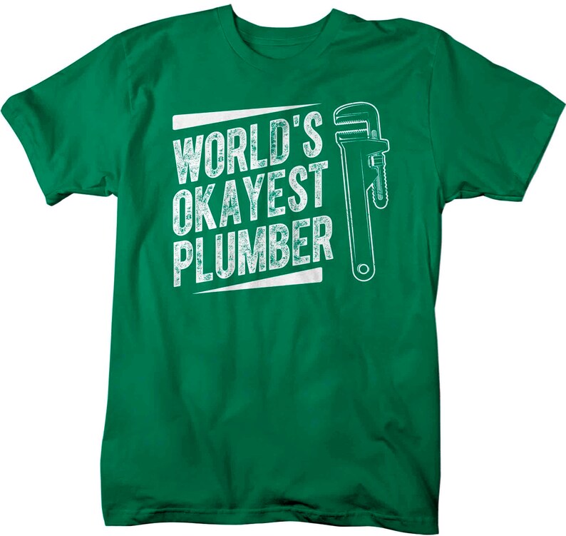 May include: Green t-shirt with a white graphic that says "World's Okayest Plumber" and a wrench illustration.