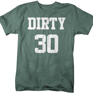 May include: A green t-shirt with the text "DIRTY 30" in white.