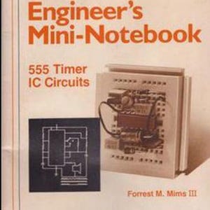 May include: A vintage book titled "Engineer's Mini-Notebook" with the text "555 Timer IC Circuits" and the author's name "Forrest M. Mims III". The book cover features a circuit board with a 555 timer chip and a schematic diagram of the chip.