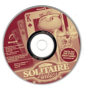 May include: A Solitaire Antics Deluxe CD-ROM. The disc features a cartoon frog character wearing a crown and holding a playing card. The disc has the text "Solitaire Antics Deluxe" and "Check out our other great games".