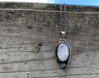 A beautiful handmade sterling silver Rainbow Moonstone pendant,  rainbow moonstone oval cabochon, serrated setting