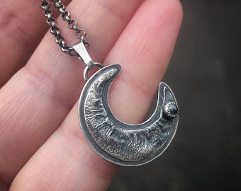 Sterling silver crescent moon with a tiny 3mm Hematite in a serrated setting, ooak jewelry