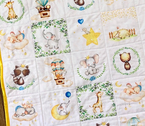 Childs handmade quilt with elephants and giraffes on it in like new condition