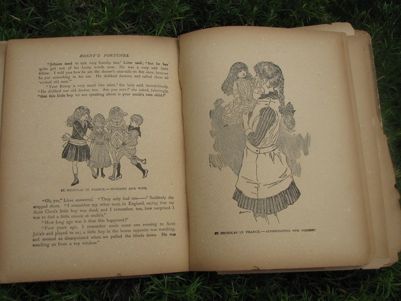 May include: An open book with black and white illustrations. The book is titled "Bonny's Fortunes" and features text from the story. The illustrations depict children in various scenes.
