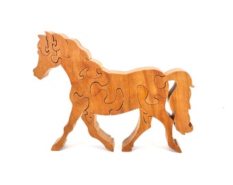 May include: A wooden horse puzzle with intricate cutouts. The horse is brown and has a long mane and tail. The puzzle is made of multiple pieces that fit together to form the shape of a horse.