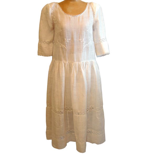 Embroidered white linen drop-waist dress made from