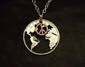 Peace on earth coin jewelry pendant cut from a quarter with a peace symbol cut from a penny