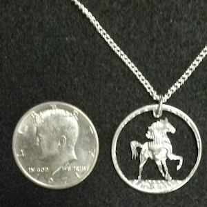 Stallion coin jewelry pendant cut from a Kennedy half dollar