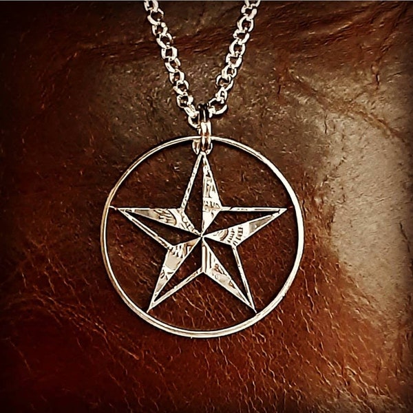 Texas star pendant cut from a half dollar coin