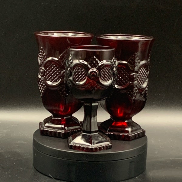 Avon Cape Cod ruby red mugs and wine glass. 1970s red Avon glass. Avon Cape Code replacement pieces. Excellent vintage condition. No boxes.