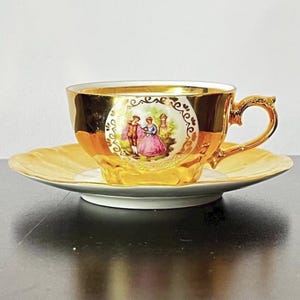 22k Gold Demitasse coffee or tea cup and saucer. Midcentury half cup made in Wunsiedel, Bavaria, Germany.