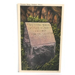 May include: A vintage postcard featuring the Equator Stone in Eastport, Maine. The stone is engraved with the text: THIS STONE MARKS LATITUDE 45 NORTH HALFWAY FROM THE EQUATOR TO THE POLE 896. The monument is surrounded by green grass and rock formations.