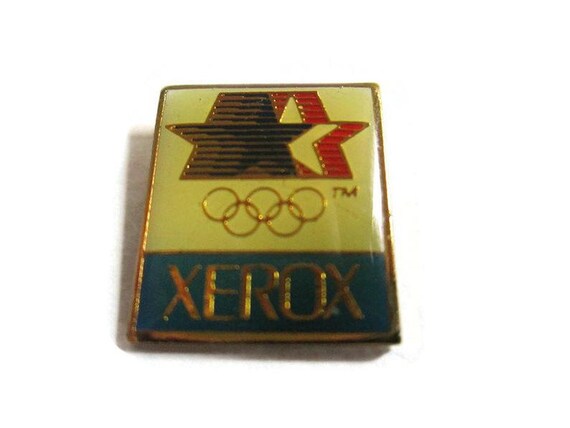 Gold Colored Rings Xerox Los Angeles California USA Stars In Motion Logo 1984 Summer Games Vintage Olympic Pin