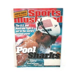 May include: Sports Illustrated magazine cover featuring a swimmer in a cap with the American flag. The headline reads "The U.S. and Australia fight it out in the world's fastest water." The title "Pool Sharks" is also visible.