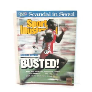 May include: A vintage Sports Illustrated magazine cover with the headline "Scandal in Seoul." The cover features a runner in a red uniform with the word "BUSTED!" in large letters. The magazine's title is in yellow.