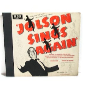 May include: Vintage vinyl record album cover for "Jolson Sings Again" by Decca Records. The cover features a black and white illustration of Al Jolson in a tuxedo, with the title in large red letters. Includes song titles.