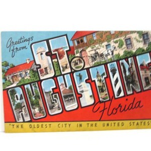 May include: A vintage-style postcard featuring the text Greetings from St. Augustine Florida The oldest city in the United States. The large letters contain illustrations of historical buildings, a horse-drawn carriage, and a lighthouse.