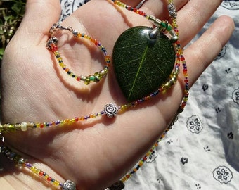 Beautiful leaf pendant, with flower beads.