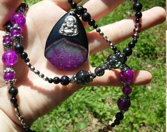 Purple with black agate geode pendant, with buddha charm.