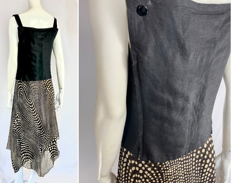 May include: A black sleeveless top with wide straps and a black and white polka dot skirt. The top has a square neckline and a button detail on the back. The skirt has an asymmetrical hemline.