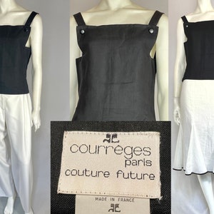 May include: Black sleeveless top with square neckline and button details. Paired with white pants and skirt. The label reads "courreges paris couture future". Made in France.
