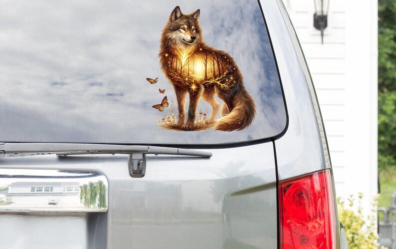May include: A wolf with a forest scene inside its body, surrounded by butterflies. The wolf is standing on a grassy area with a sunset in the background.