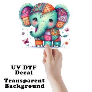 May include: A colorful patchwork elephant with big eyes and a long trunk. The elephant is surrounded by butterflies and flowers. The image is labeled "UV DTF Decal Transparent Background".