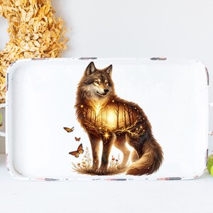 May include: A white metal tray with a wolf illustration. The wolf is depicted with a forest scene inside its body, glowing with golden light. The tray has distressed edges and two handles.