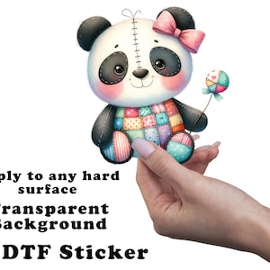 May include: A colorful UV DTF sticker featuring a cute panda bear with a patchwork design on its body. The panda has a pink bow, black and white details, and holds a lollipop. The sticker is designed to apply to any hard surface.