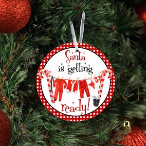 Santa is Getting Ready Round Ceramic Christmas Ornament