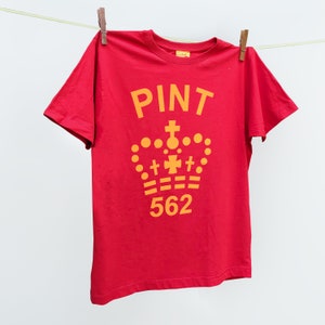 May include: Red short-sleeved t-shirt with a yellow graphic of a crown and the text "PINT 562".