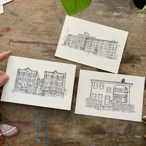May include: Three black and white line drawings of buildings on white card stock. The first drawing shows a two-story building with a flat roof. The second drawing shows a three-story building with a flat roof. The third drawing shows a one-story building with a pitched roof.